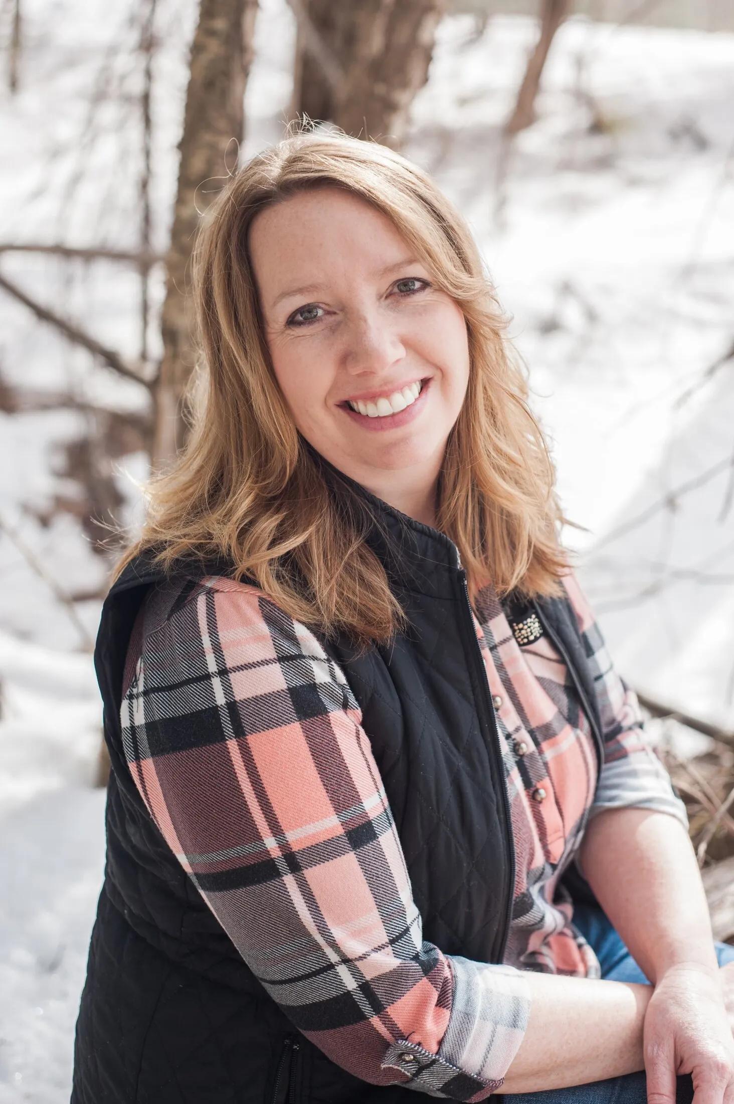 Patient smiling in winter — “Ask Dr. Carroll about smile makeovers.”